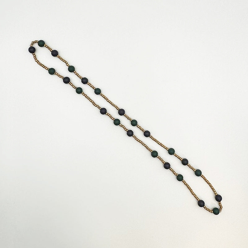 Gold Bead with Dark green circles